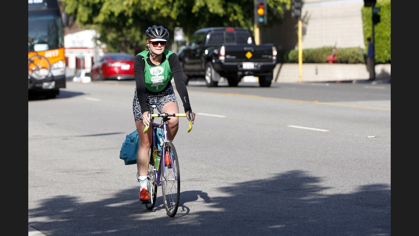 Rosalind Morehead, of South Pasadena, rode her bike from home to her job at D.C. Comics, at the Pointe, on the 2900 block of West Alameda, in Burbank on Thursday, May 18, 2017. The Burbank Transportation Management Organization hosted a pit stop at this location and two other bike pit stops elsewhere in Burbank for the annual Bike & Walk to Work Day.