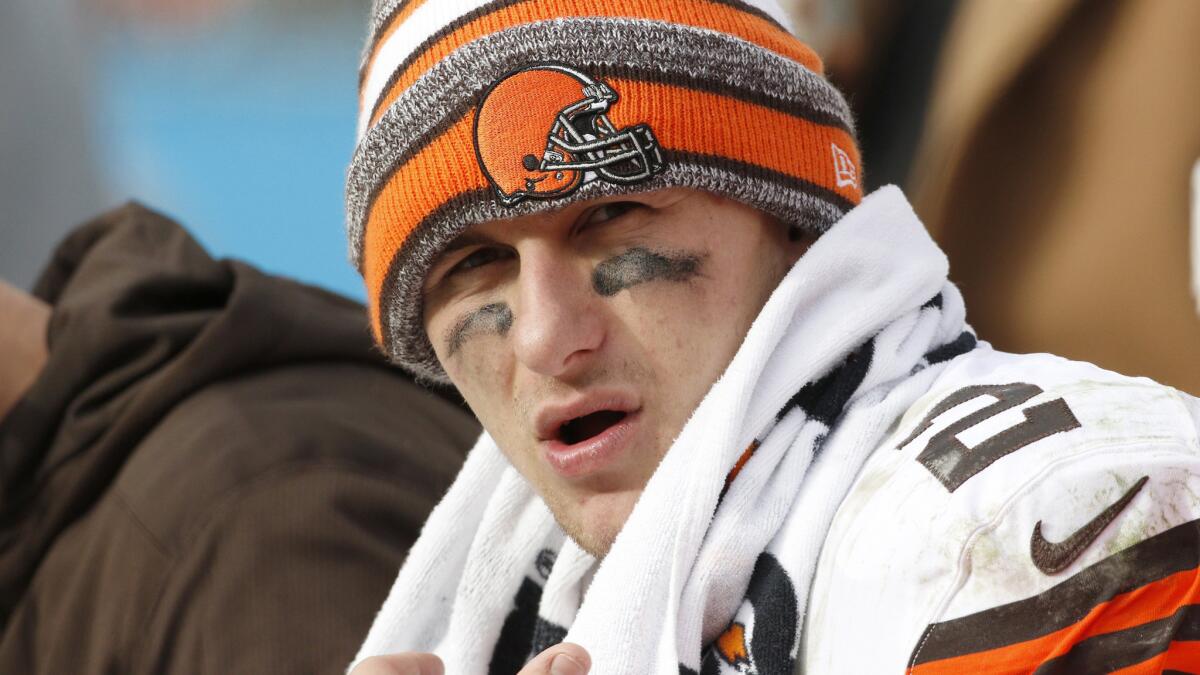 Cleveland Browns quarterback Johnny Manziel sits on the bench during a loss to the Carolina Panthers on Dec. 21.