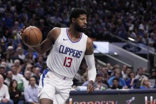 Los Angeles Clippers' Paul George works against the Dallas Mavericks in Game 2.
