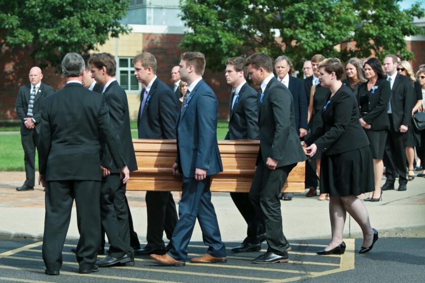 Pallbearers carry the coffin of Otto Warmbier during his funeral in Wyoming, Ohio.