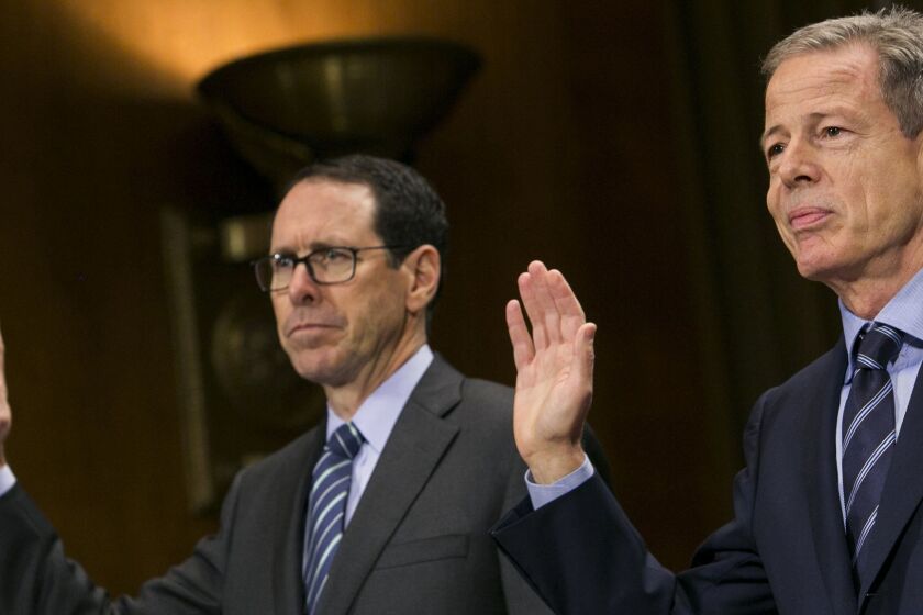 Randall Stephenson, chairman and CEO of AT&T, left, and Jeffrey Bewkes, chairman and CEO of Time Warner, right, are sworn in before the U.S. Senate Committee on the Judiciary Subcommittee on Antitrust, Competition Policy & Consumer Rights during a hearing on the pending AT&T and Time Warner merger in Washington, D.C. on Dec. 7, 2016. (Kristoffer Tripplaar/Sipa USA/TNS) ** OUTS - ELSENT, FPG, TCN - OUTS **