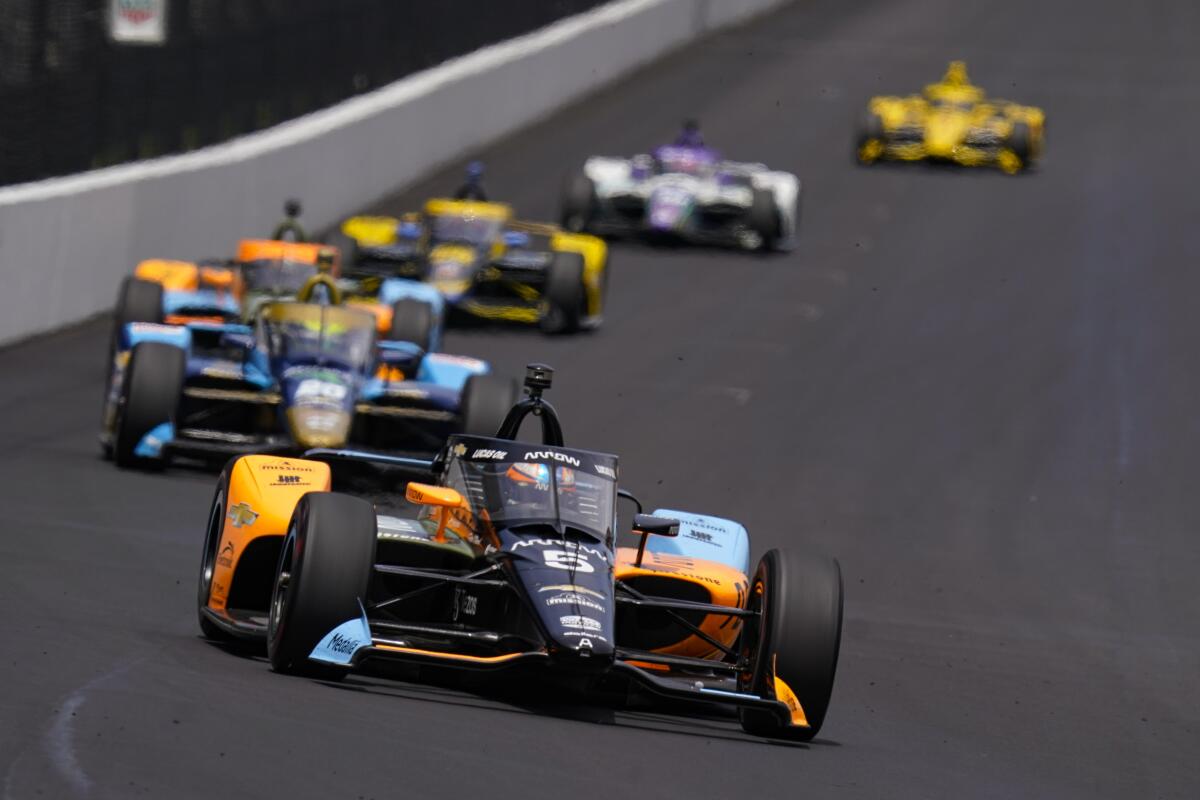 Pato O'Ward, of Mexico, heads into the first turn during practice for the Indianapolis 500.