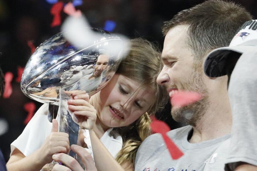 New England Patriots quarterback Tom Brady shares a moment with daughter Vivian Lake Brady after winning his sixth Super Bowl, 13-3, against the Los Angeles Rams in Super Bowl LIII at Mercedes-Benz Stadium in Atlanta on Sunday, Feb. 3, 2019. (Bob Andres/Atlanta Journal-Constitution/TNS) ** OUTS - ELSENT, FPG, TCN - OUTS **