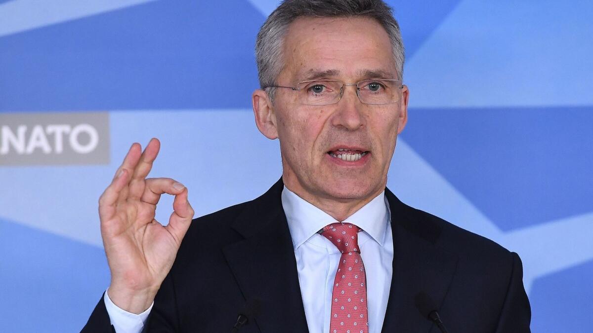 NATO Secretary-General Jens Stoltenberg addresses the press at NATO headquarters in Brussels on March 27, 2018.