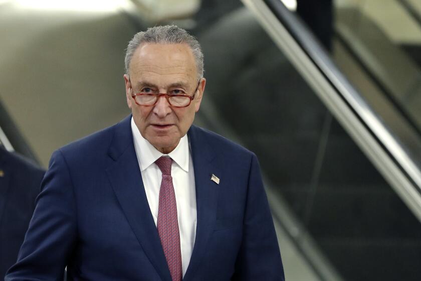 Senate Minority Leader Chuck Schumer, D-N.Y., walks on Capitol Hill in Washington, Friday, Jan. 31, 2020, during the impeachment trial of President Donald Trump on charges of abuse of power and obstruction of Congress. (AP Photo/Julio Cortez)