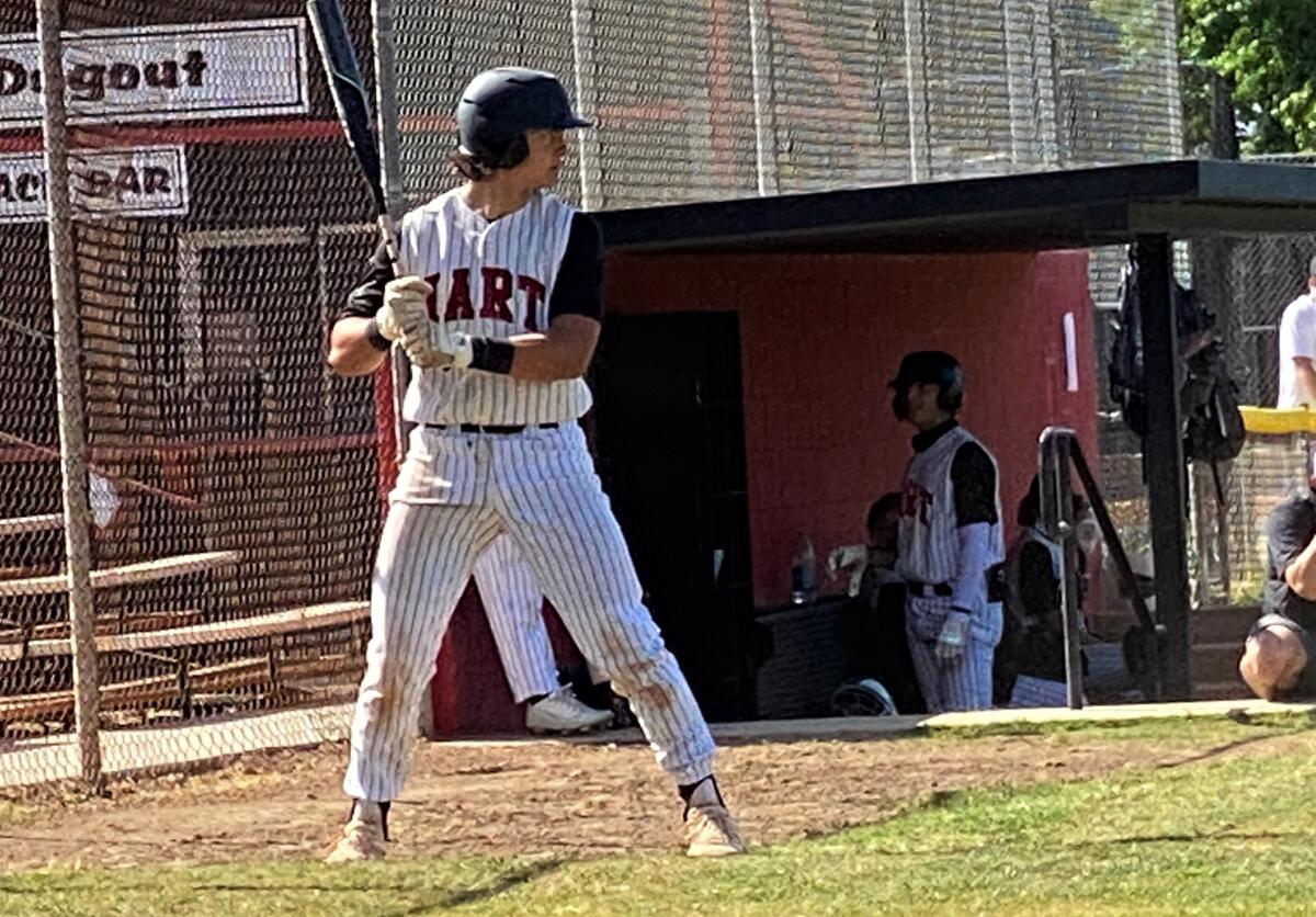 Hart High catcher Matt Quintanar rehearses his batting stance in the on-deck circle.