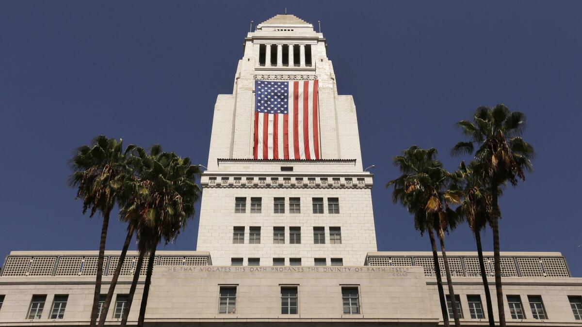 The United States flag is draped on Los Angeles City Hall on Sept. 8, 2017.