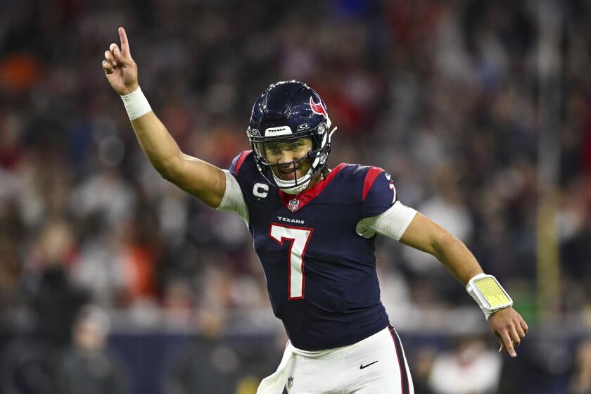 Houston Texans quarterback C.J. Stroud (7) reacts during the second half against the Cleveland Browns of an NFL wild-card playoff football game, Saturday, Jan 13, 2024 in Houston. (AP Photo/Maria Lysaker)