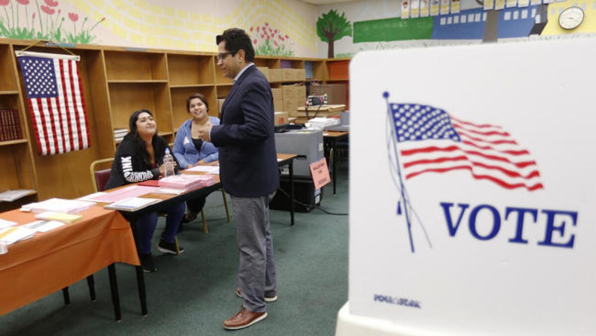 Jimmy Gomez thanks poll volunteers at Sheridan Street School in Boyle Heights during the June 6 election.