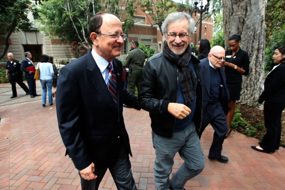 Director Steven Spielberg, founder of the USC Shoah Foundation, and USC President C.L. Max Nikias head to an event to announce an initiative that will examine how and why genocides occur, and explore new methods of intervention and prevention.