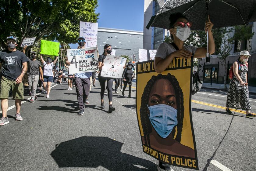 Los Angeles, CA, Sunday, July 5, 2020 - Black Lives Matter protesters walk along downtown's Second St. (Robert Gauthier / Los Angeles Times)