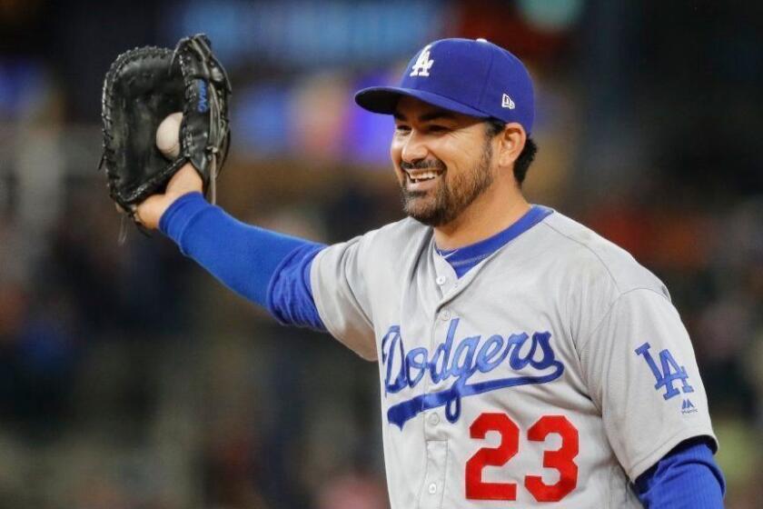 FILE - In this Aug. 18, 2017, file photo, Los Angeles Dodgers first baseman Adrian Gonzalez smiles after catching a Detroit Tigers' Ian Kinsler line drive in the eighth inning of a baseball game, in Detroit. Free agent first baseman Adrian Gonzalez and the New York Mets have finalized a one-year contract for the $545,000 major league minimum. The 35-year-old batted .242 for the Los Angeles Dodgers last season, when he was limited to 71 games because of a herniated disk in his back. A five--time All-Star, Gonzalez has a .288 career average with 311 home runs in 14 major league seasons.(AP Photo/Paul Sancya, File)