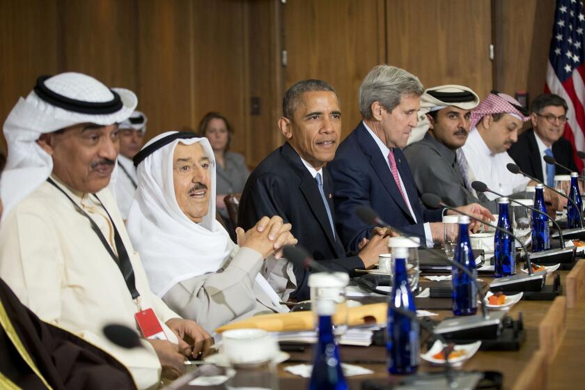 President Obama is flanked by Kuwait's emir, Sheik Sabah al Ahmed al Jabbar al Sabah, and Secretary of State John F. Kerry during a summit with Gulf Cooperation Council leaders at the presidential retreat at Camp David in Maryland on Thursday.