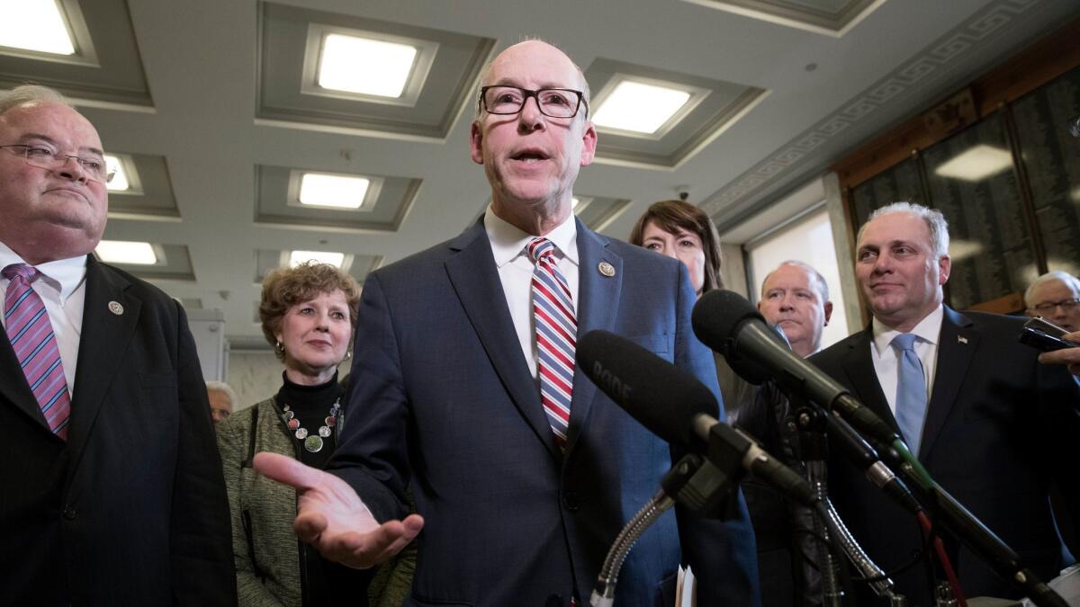 Chairman of the House Energy and Commerce Committee, Republican from Oregon Greg Walden (C) speaks to members of the news media after the committee voted to advance the American Health Care Act, in Washington on March 9.