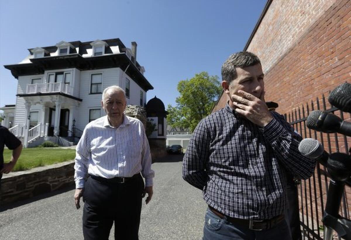 Ruslan Tsarni, uncle of slain Boston bombing suspect Tamerlan Tsarnaev, told reporters his nephew should be buried in Cambridge. City officials have said they would reject a burial permit application. At left is Peter Stefan of the Graham, Putnam & Mahoney Funeral Parlors in Worcestor, Mass.