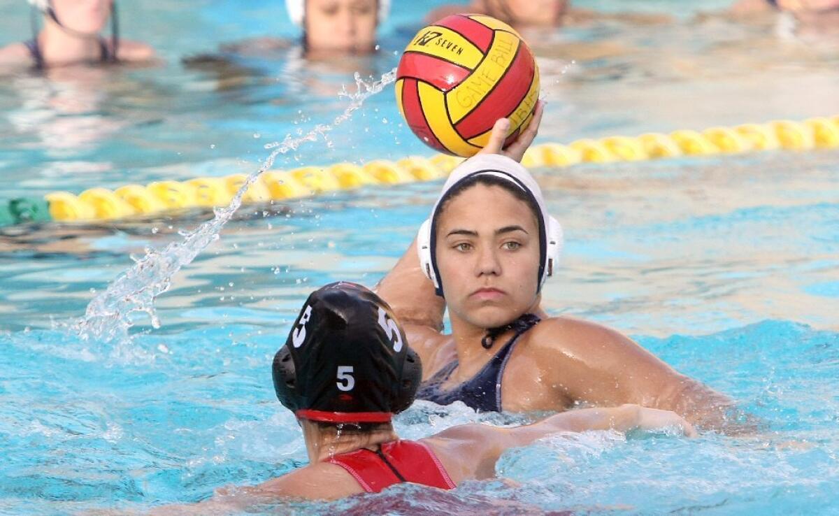 Crescenta Valley High's Kaitlyn Moguel looks for an open lane with Burroughs' Viktorya Saroyan defending.