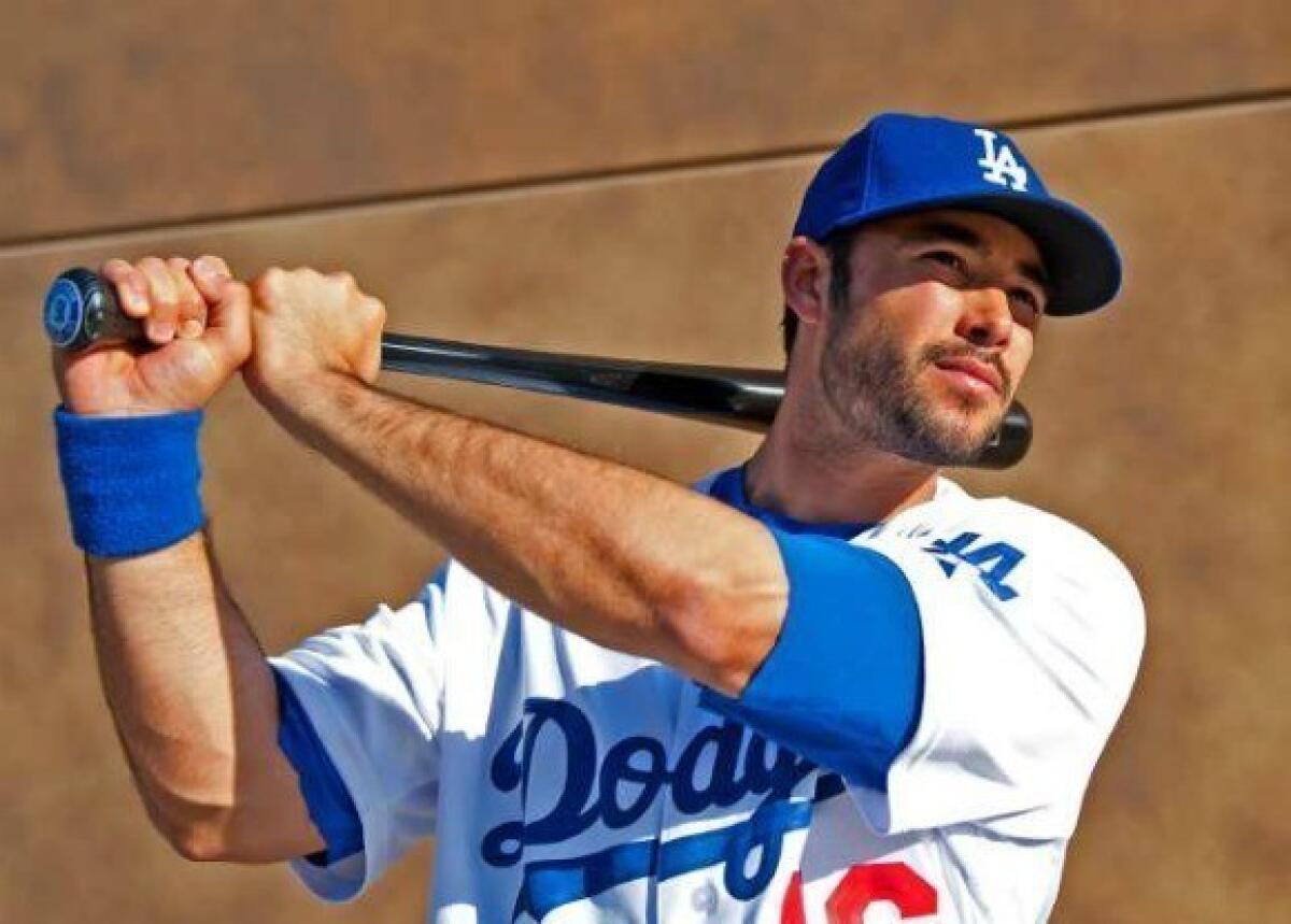 Andre Ethier takes a swing during media/photo day.