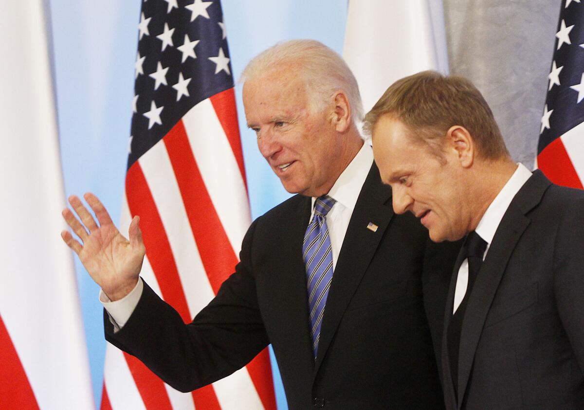Vice President Joe Biden, left, and Poland's Prime Minister Donald Tusk head for talks Tuesday in Warsaw on Eastern Europe's security.