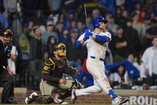 Chicago Cubs' Michael Busch watches his game-winning solo home run against the San Diego Padres during the ninth inning of a baseball game Tuesday, May 7, 2024, in Chicago. (AP Photo/Erin Hooley)