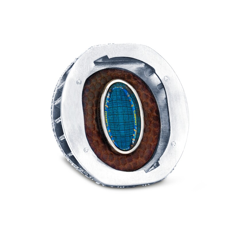 The underside of the ring's removable top features a piece of a Super Bowl LVI game ball.