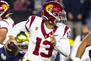 Southern California quarterback Caleb Williams (13) runs with the ball during the first half of an NCAA college football game against Notre Dame, Oct. 14, 2023, in South Bend, Ind. (AP Photo/Michael Caterina)