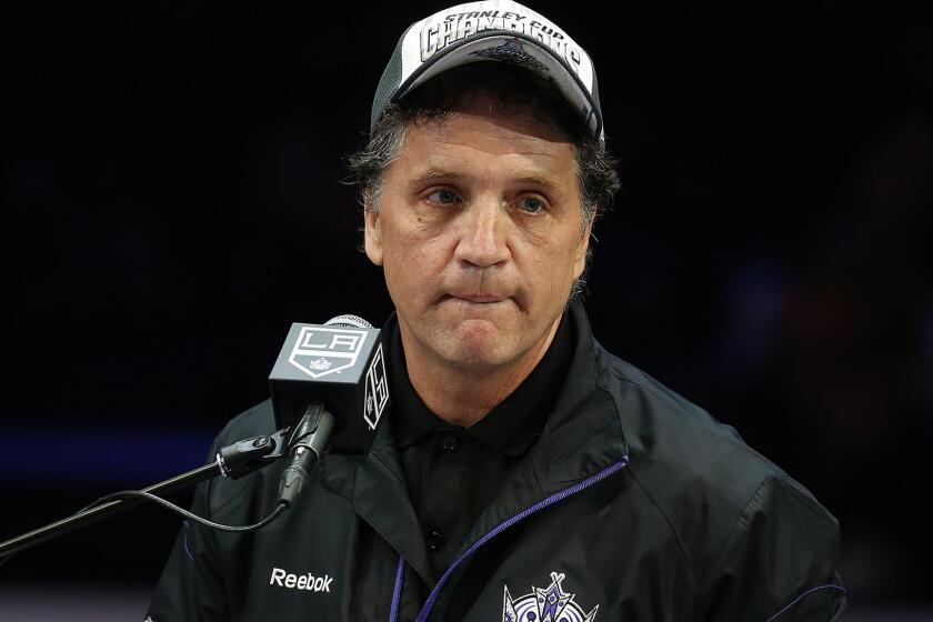Kings General Manager Dean Lombardi speaks during the team's Stanley Cup championship rally at Staples Center in June.