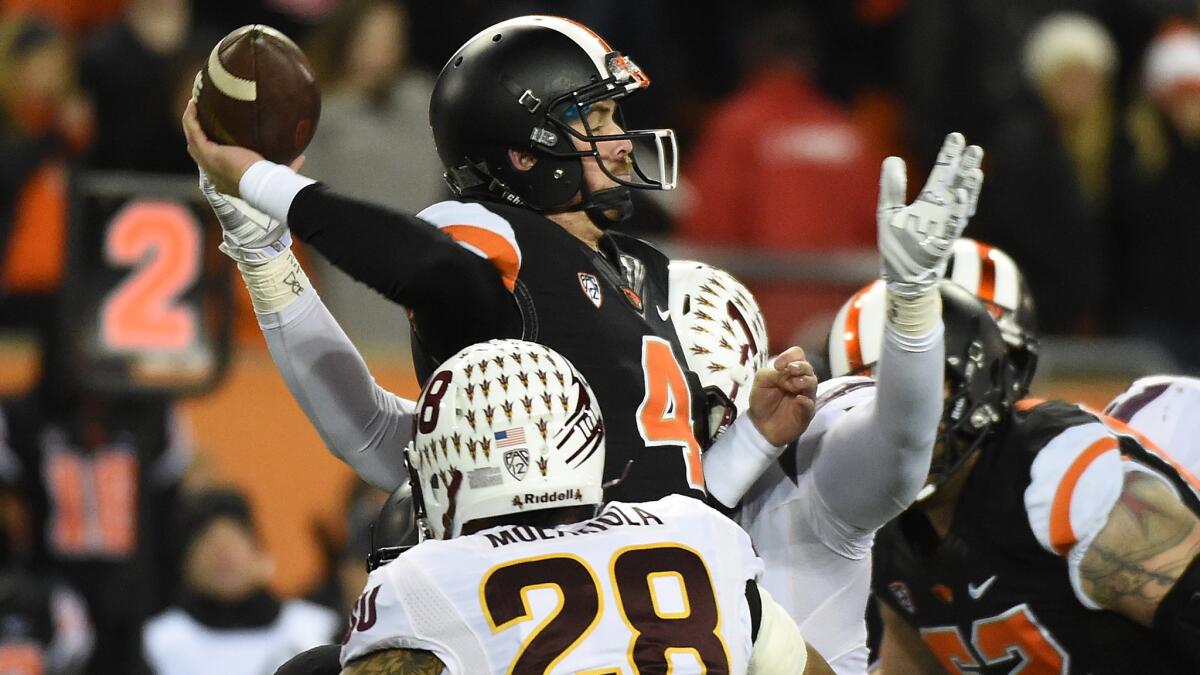 Oregon State quarterback Sean Mannion throws under pressure during the first quarter of the Beavers' 35-27 upset over Arizona State on Saturday night.
