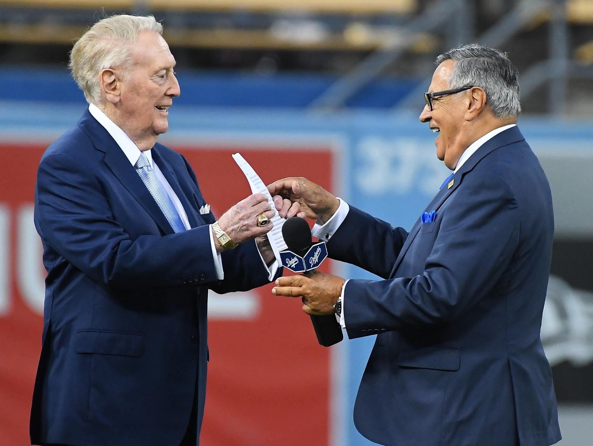 Dodgers broadcaster Vin Scully, left, jokes with Spanish-language broadcaster Jaime  Jarrín.