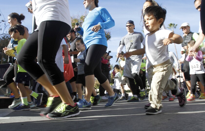 Along with many others, this little baby boy participated in the 5th annual Burbank Community YMCA Turkey Trot Kids Run in Burbank on Thursday, Nov. 27, 2014.