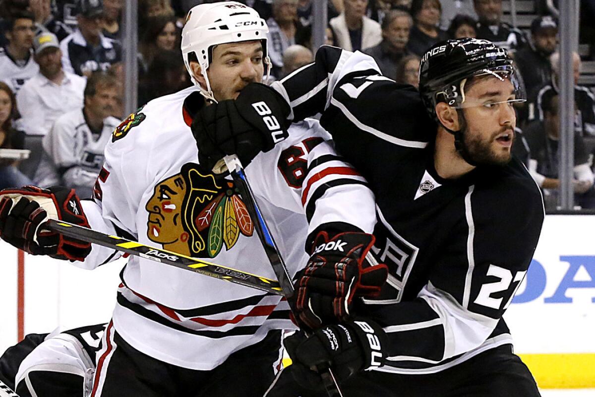 Kings defenseman Alec Martinez, fighting for position with Blackhawks forward Andrew Shaw in the playoffs last spring, has become a leader on the decimated back line for L.A.