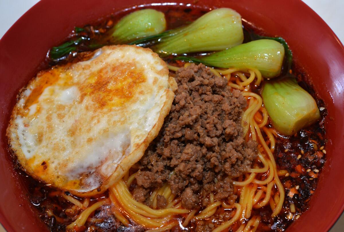 The Chongqing noodles with an egg, meat and bok choy served in a hearty bowl at the Chong Qing Special Noodles in San Gabriel.