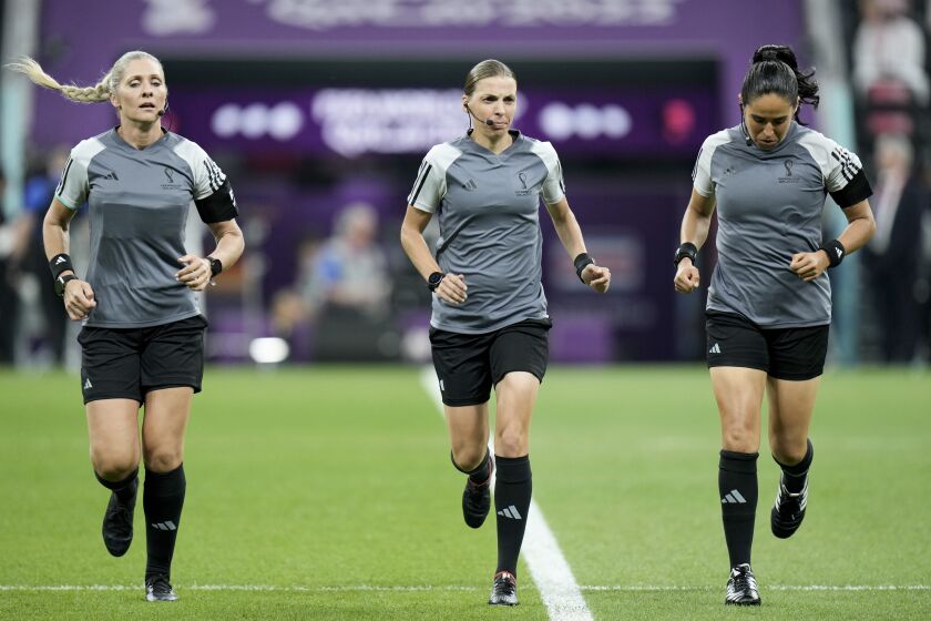 Referee Stephanie Frappart, center, assistants referee Neuza Back, left, and Karen Diaz warm up prior to the World Cup group E soccer match between Costa Rica and Germany at the Al Bayt Stadium in Al Khor , Qatar, Thursday, Dec. 1, 2022. (AP Photo/Hassan Ammar)