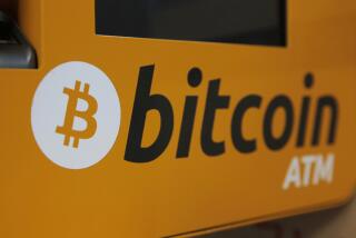 A Bitcoin logo is shown is displayed on an ATM in Hong Kong, Thursday, Dec. 21, 2017. Bitcoin is the world's most popular virtual currency. Such currencies are not tied to a bank or government and allow users to spend money anonymously. They are basically lines of computer code that are digitally signed each time they are traded. (AP Photo/Kin Cheung)