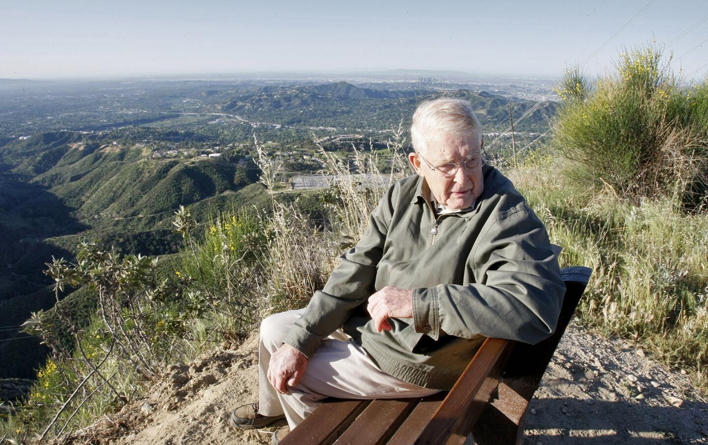 After a contemplative, steady pace up Mt. Lukens Truck Trail for about half an hour, Reg Green takes a break to get in the view of the L.A. Basin from the Angeles National Forest on Tuesday, April 9, 2013. The 84-yr. old La Canada Flintridge resident has been walking up this trail for about 9 years, 3-4 times per week. The bench was placed for him at the location by a local firefighter.