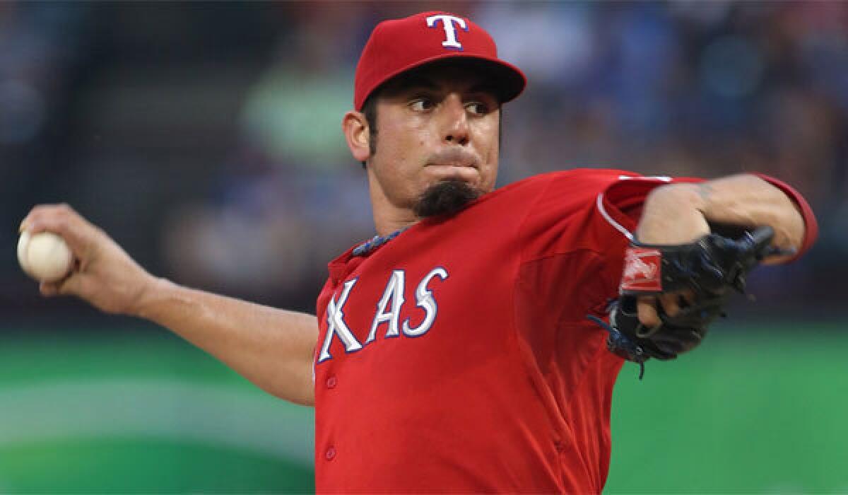 The Angels have been targeting free-agent pitcher Matt Garza, shown with Texas last season, since November.