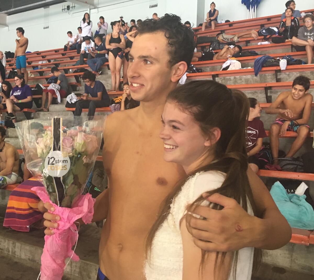 Palisades swimmer Zachary Senator asked fellow senior Kaitlyn Purcell if she would go to the prom before Friday's City Section swim finals. She said, "Yes."