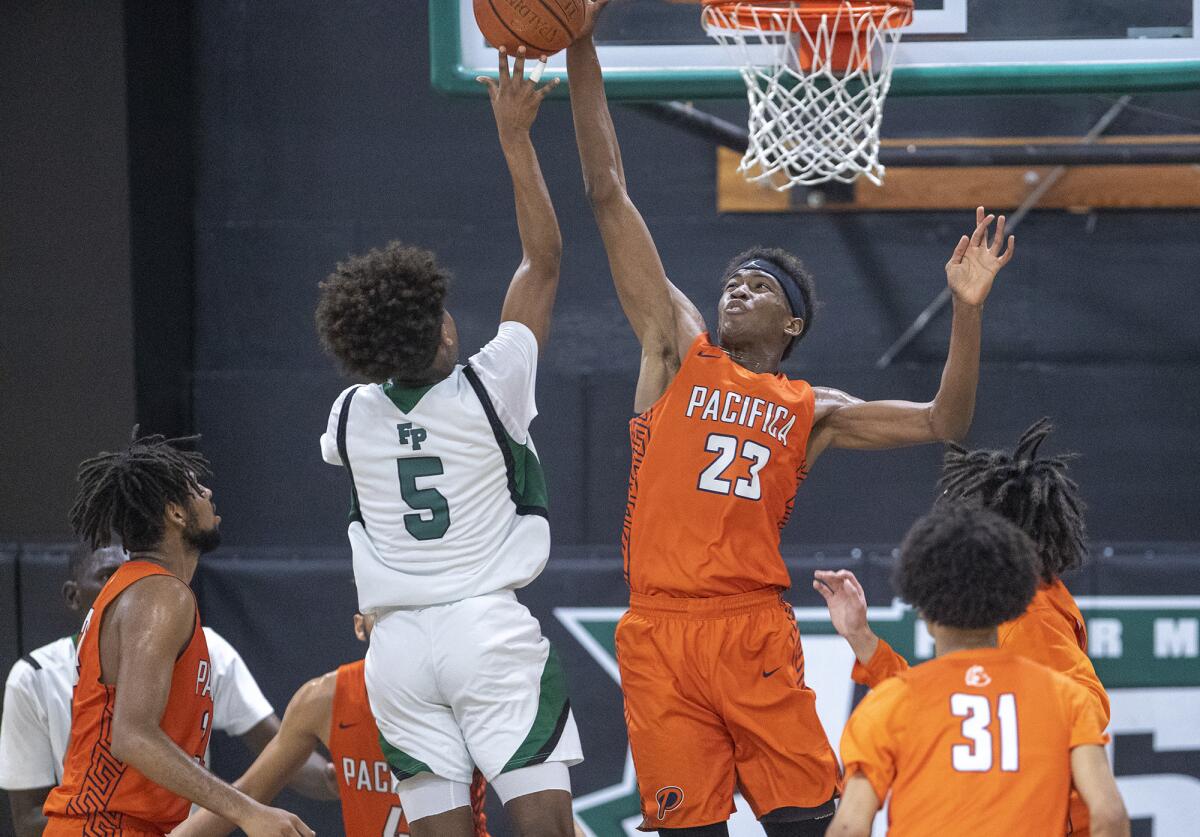 Pacifica Christian Orange County's Judah Brown (23), shown attempting to block a shot against Fairmont Prep in a Feb. 28, 2019 game, helped the Tritons beat the Huskies 62-59 on Tuesday.