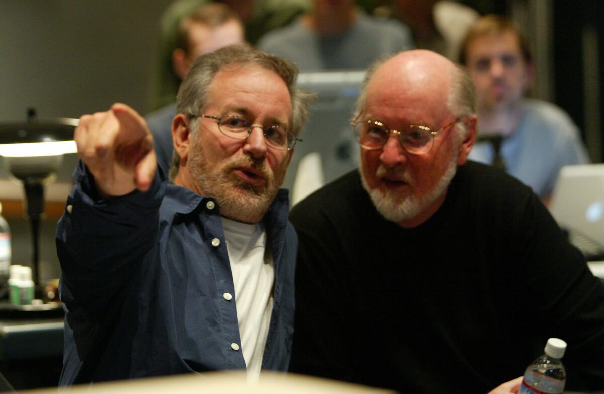 Director Steven Spielberg, left,and John Williams during a scoring session for "Catch Me If You Can" on Oct. 2, 2002. (Los Angeles Times)