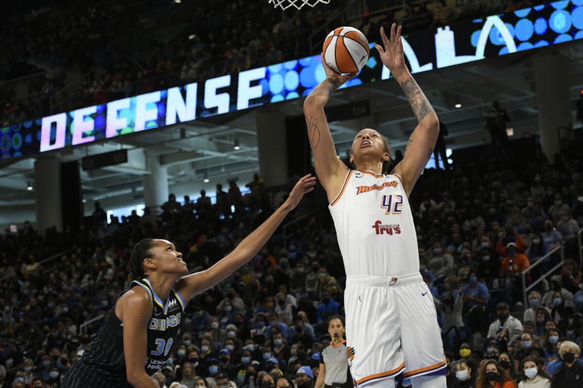 Phoenix Mercury's Brittney Griner (42) shoots against Chicago Sky's Azura Stevens (30) during the first half of Game 4 of the WNBA Finals, Sunday, Oct. 17, 2021, in Chicago. (AP Photo/Paul Beaty)