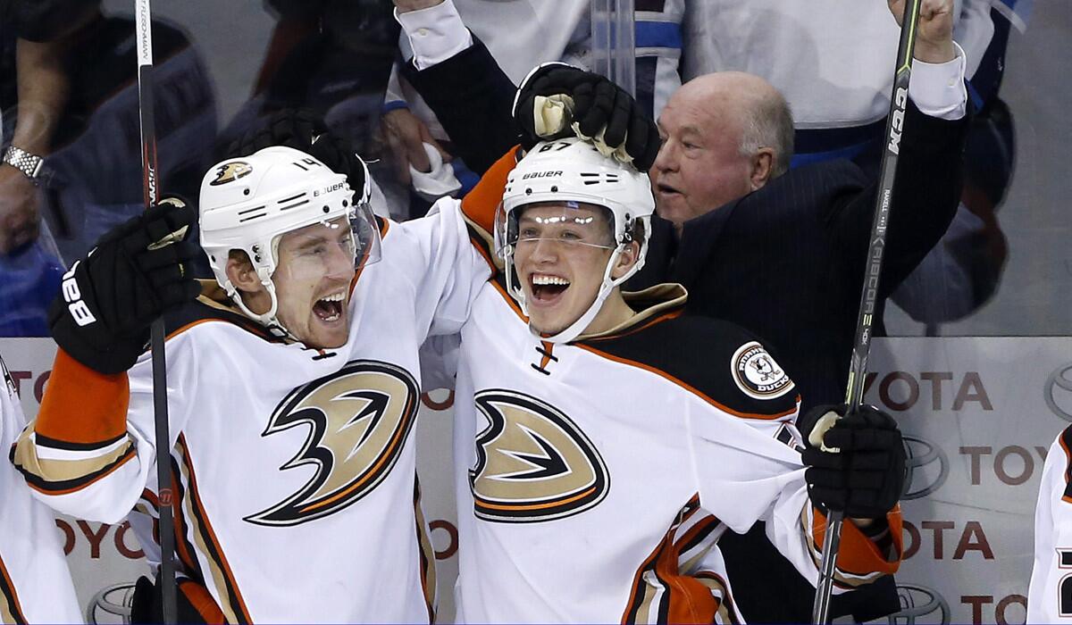 Anaheim Ducks' Tomas Fleischmann, left, and Rickard Rakell celebrate a goal against the Winnipeg Jets during the third period of Game 4 of a first-round of the Stanley Cup playoffs on Wednesday. Anaheim won 5-2 and swept the series.