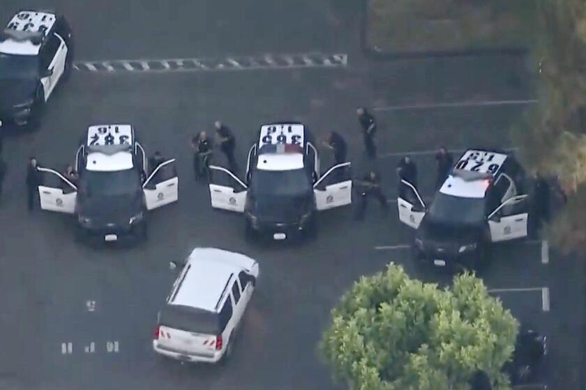 A man suspected of leading law enforcement officers on a chase in a stolen Los Angeles Department of Water and Power vehicle is into custody following a lengthy standoff in Atwater Village.