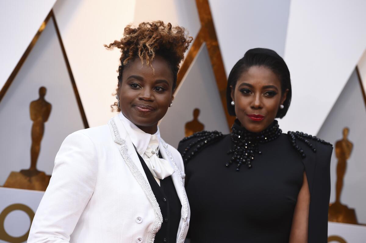 Author Sarah M. Broom, left, and "Mudbound" director Dee Rees arrive at the Oscars.