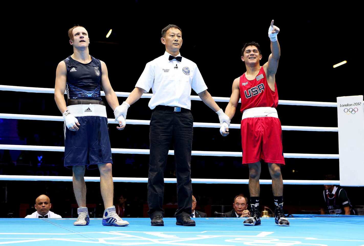 Joseph Diaz Jr., right, of the United States celebrates his bantamweight victory over Pavlo Ishchenko of Ukraine Saturday at the 2012 London Olympics.