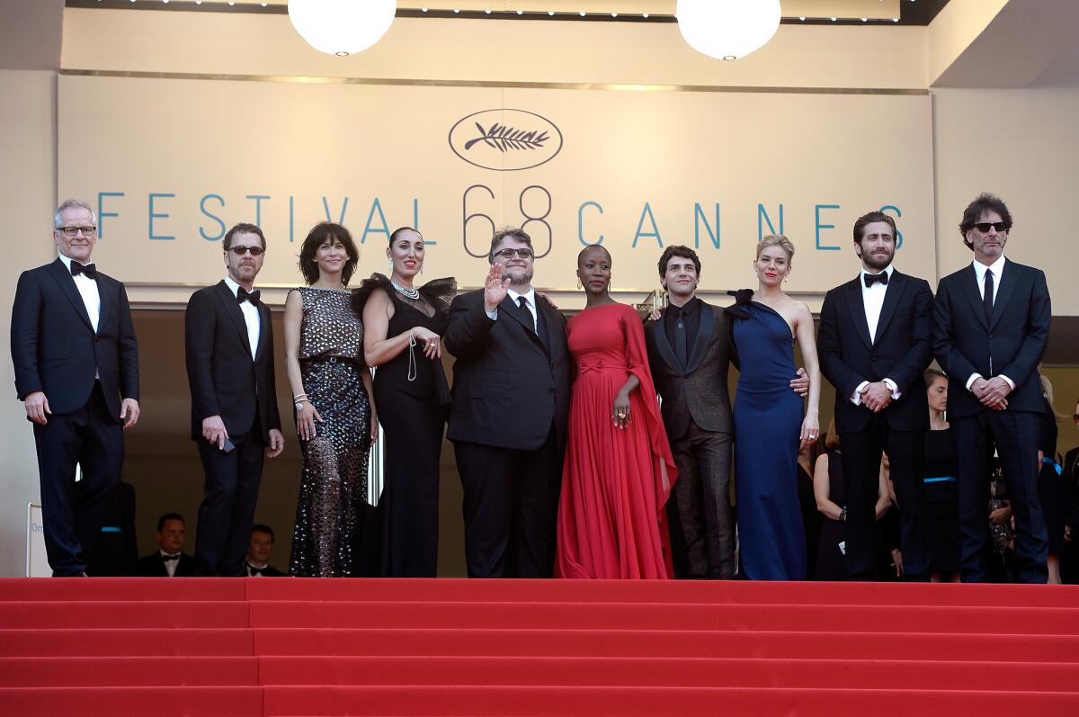 Members of the Cannes jury at the opening ceremony and premiere of "La Tete Haute" ("Standing Tall"), from left, General Delegate of the Cannes Film Festival Thierry Fremaux and jury members Ethan Coen, Sophie Marceau, Rossy de Palma, Guillermo del Toro, Rokia Traore, Xavier Dolan, Sienna Miller, Jake Gyllenhaal and Joel Coen.