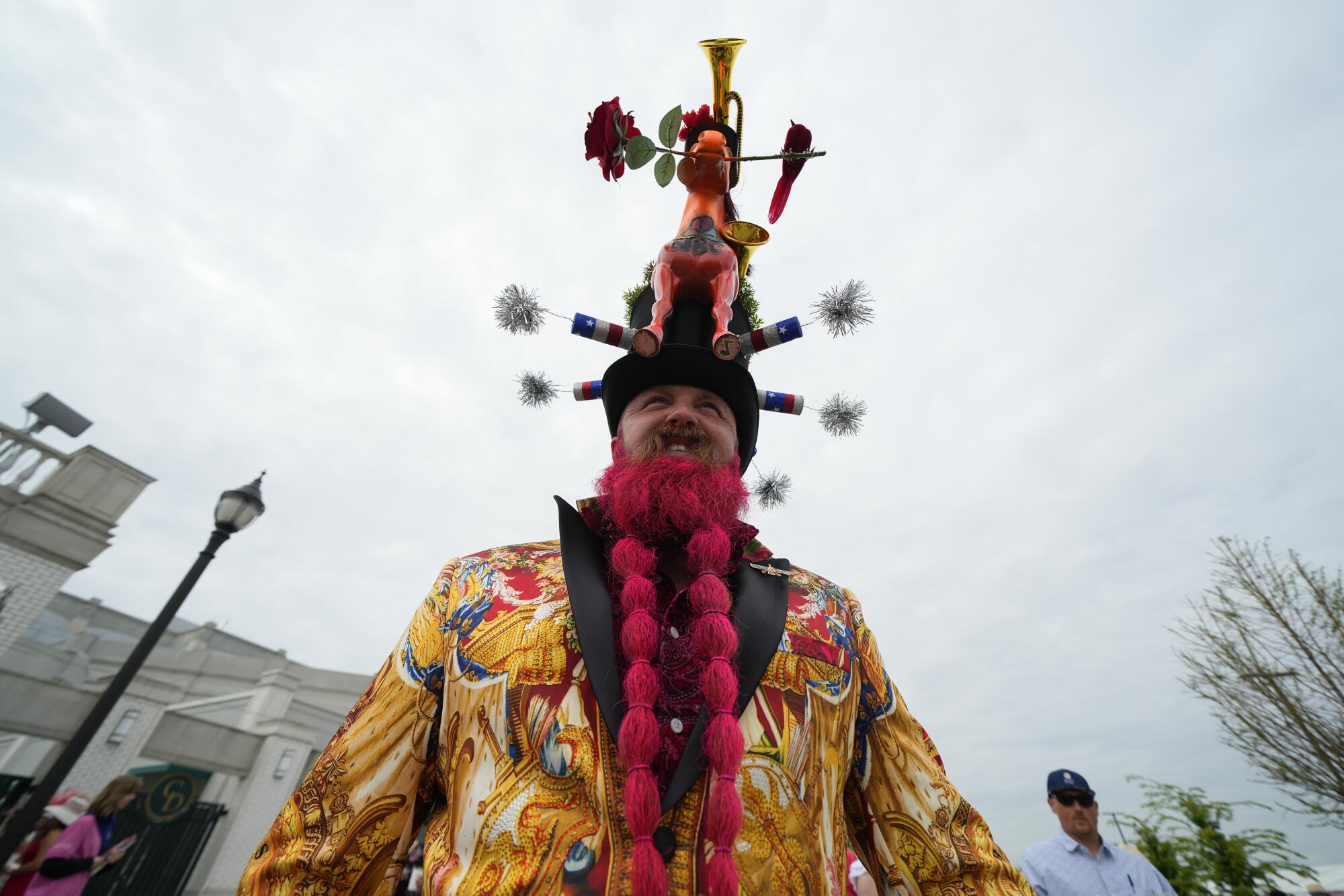 Garey Faulkner from Cincinnati shows off his elaborate suit and hat combination at Churchill Downs on Saturday.