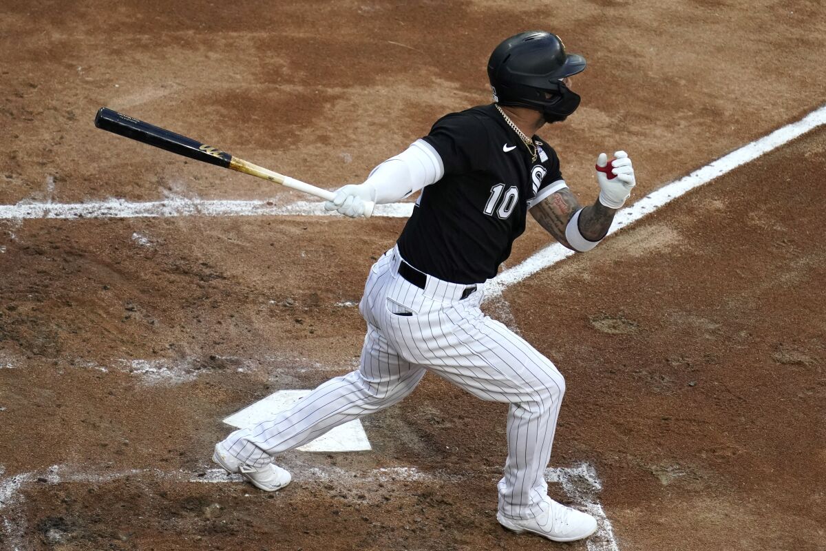 Chicago White Sox's Yoan Moncada watches his solo home run during the first inning of the team's baseball game against the Detroit Tigers in Chicago, Thursday, June 3, 2021. (AP Photo/Nam Y. Huh)
