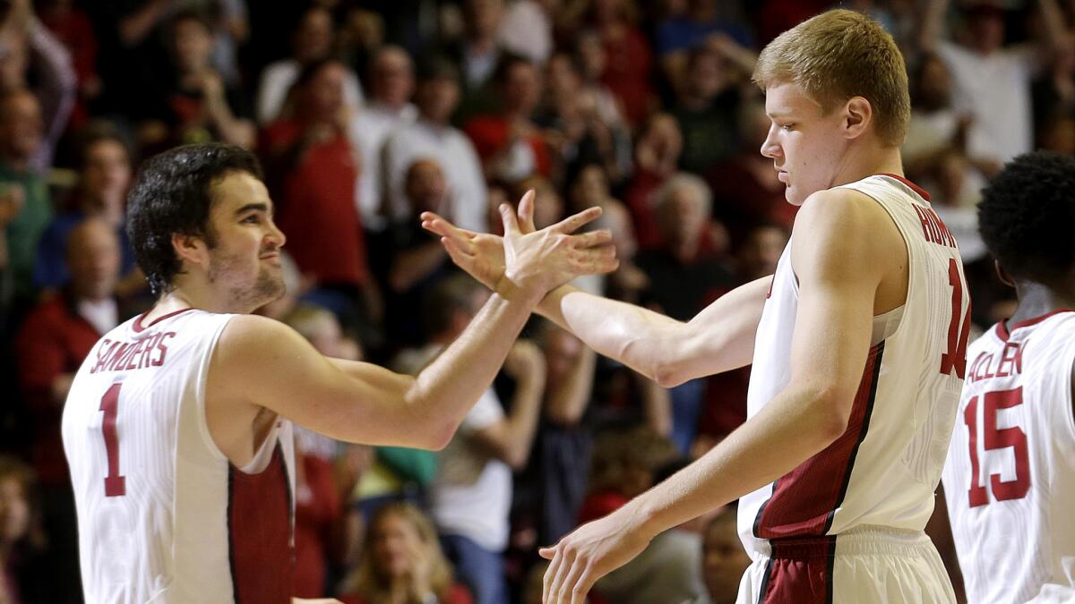 Stanford's Christian Sanders (1) and Michael Humphrey celebrate during the closing moments of their victory over Oregon on Saturday.