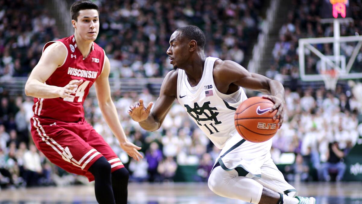 Michigan State guard Lourawls Nairn Jr. drives to the basket against Wisconsin guard Bronson Koenig during the first half SUnday.