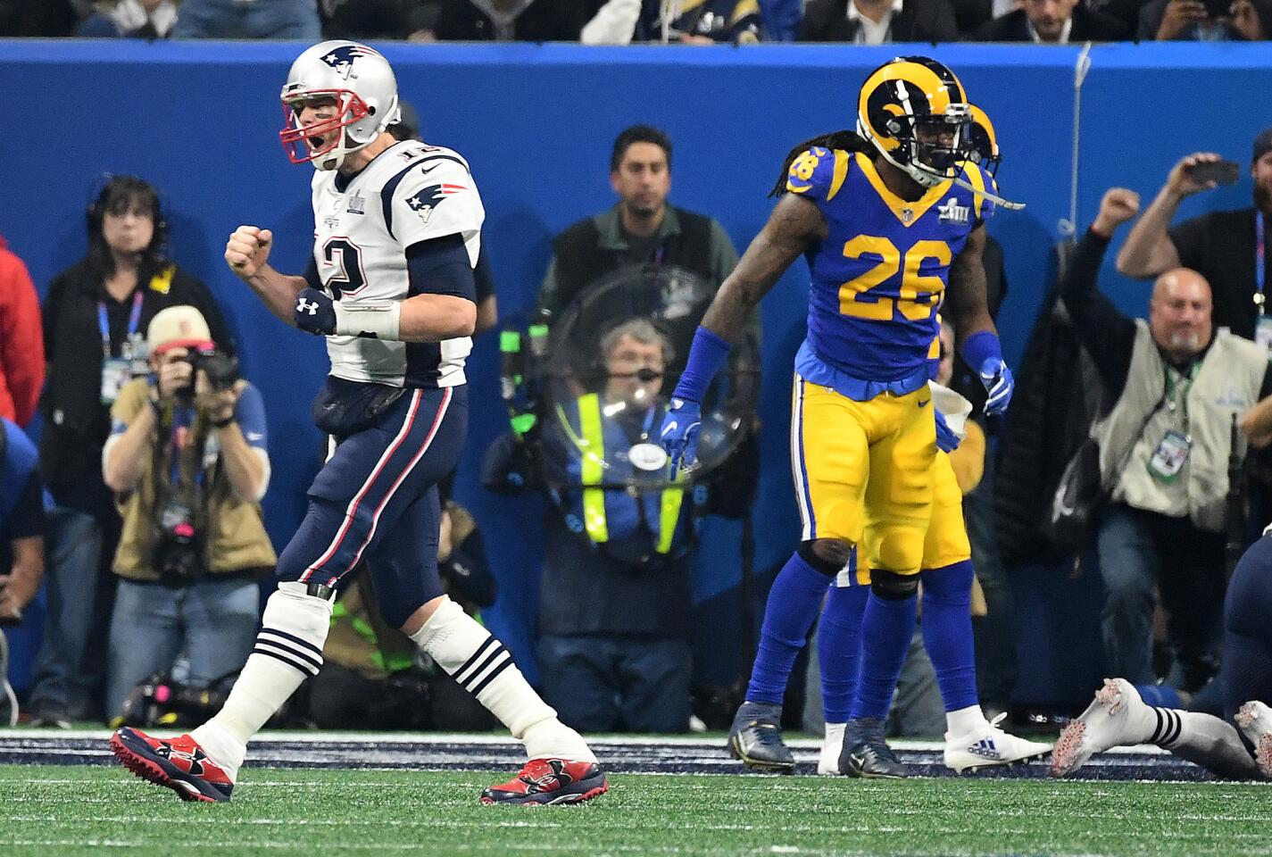 Patriots quarterback Tom Brady celebrates a touchdown by Sony Michel against the Rams inthe 4th quarter in Super Bowl LIII at Mercedes Benz Satdium in Atlanta Sunday.