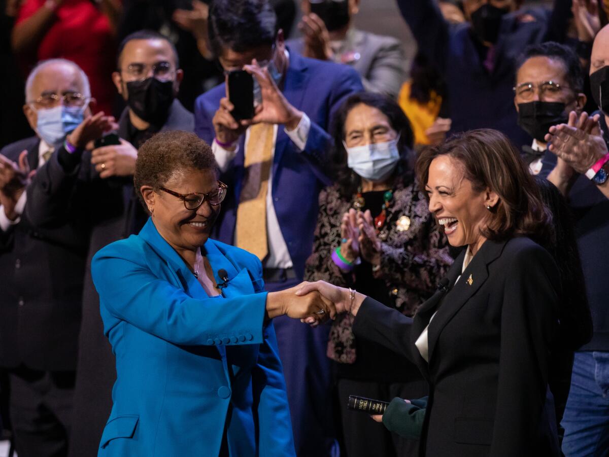 Los Angeles Mayor Karen Bass shakes hands with Vice President Kamala Harris following the oath of office.